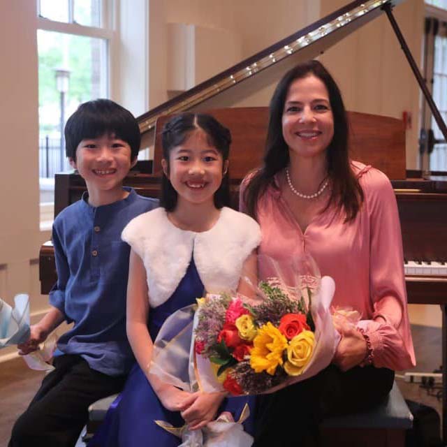 Justine St. Louis at a recital with students.